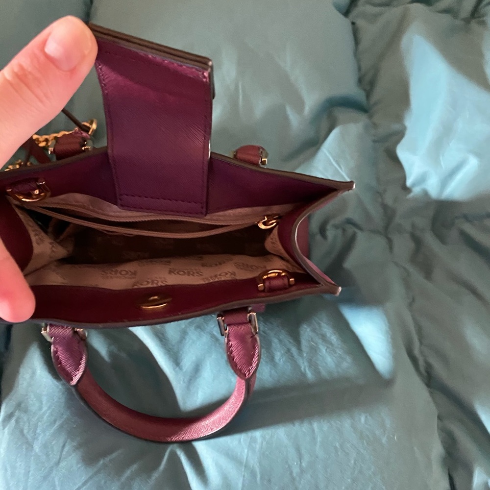 Michael Kors Hand held purse.